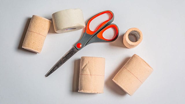 scissors, bandages and medical tape 